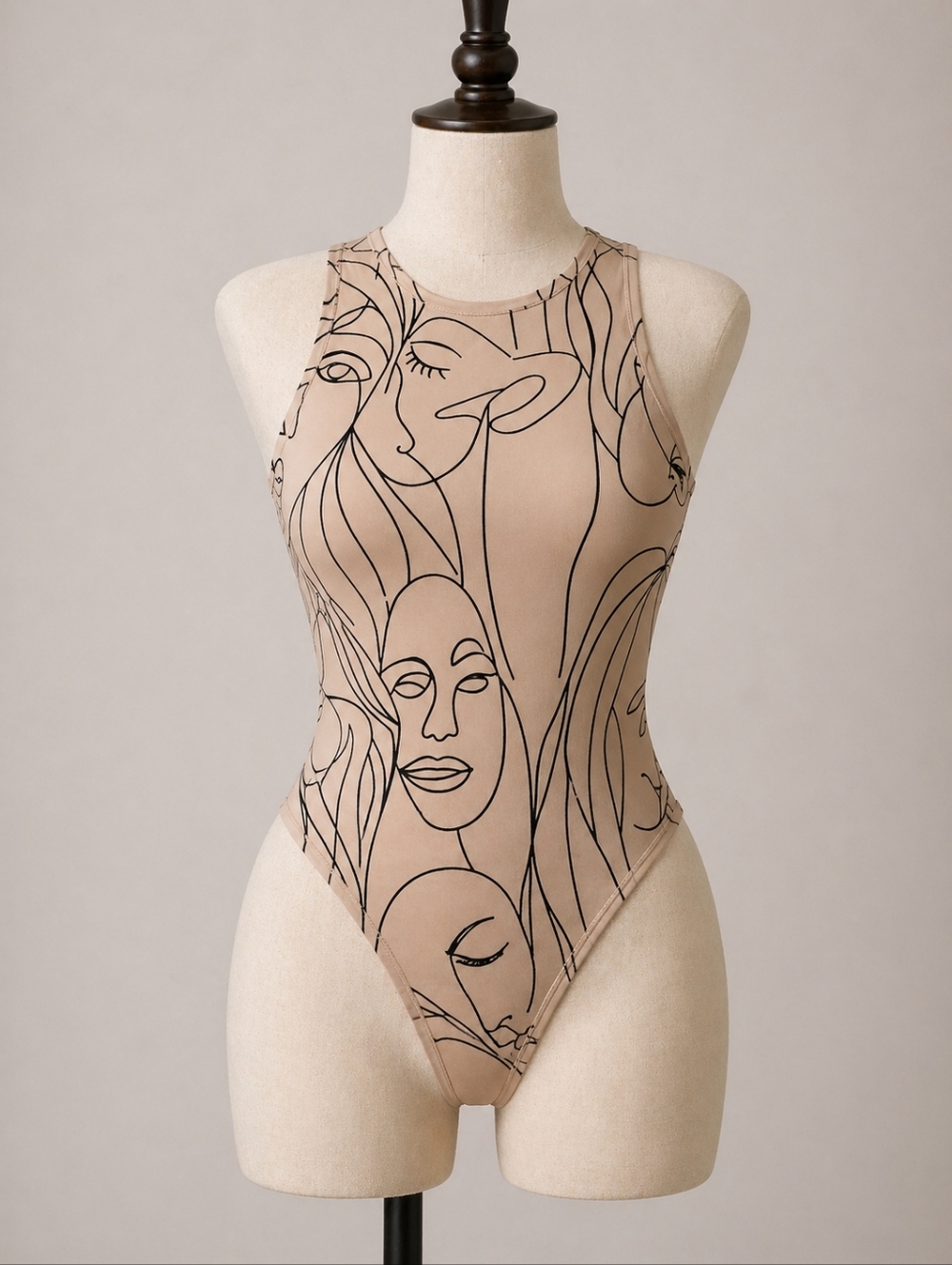 Abstract Faces High-Neck Bodysuit in Beige and Black
